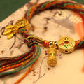 Sacred Keepsakes: Cotton Mantra Bracelet with Glass Locket and 6 Syllable Charms