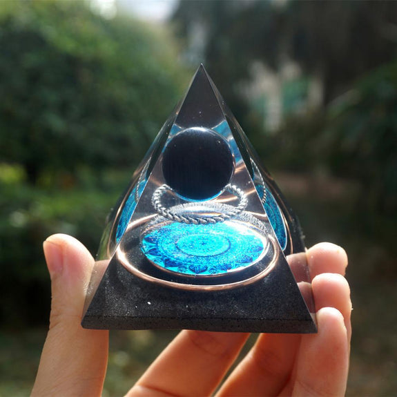 https://zenheavens.com/cdn/shop/products/Handmade-Orgonite-Pyramid-60mm-Obsidian-Crystal-Sphere-With-Energy-Copper-Circle-PTSD-Orgone-Accumulator-Orgone_575x575.jpg?v=1592073978