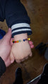 amber chakra bracelet on boys hand